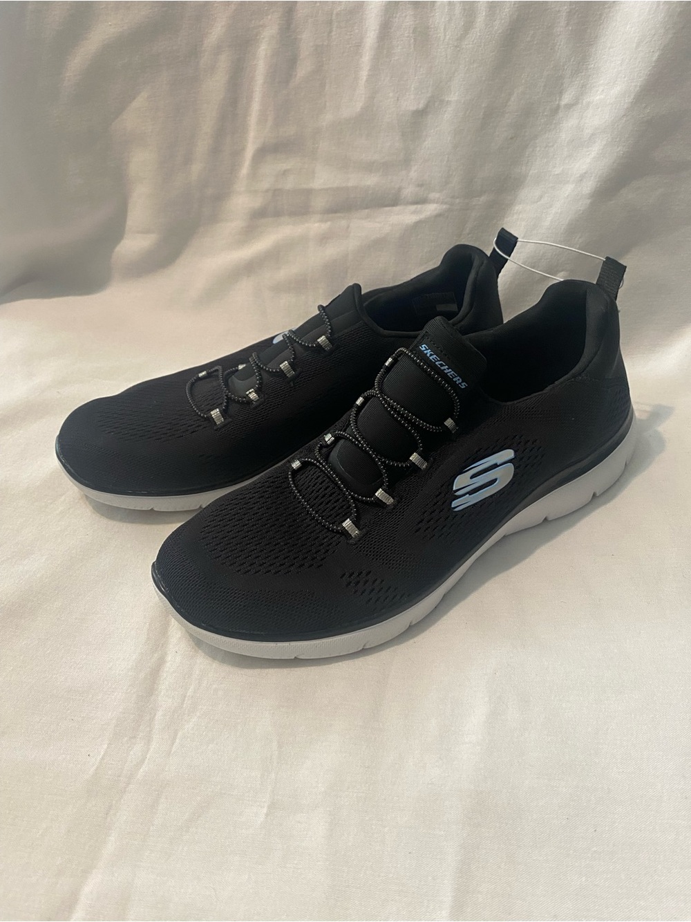 Skechers Women’s Black Knit Slip-On Sneakers with White Sole